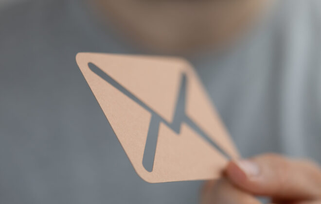 Network communications concept with a letter sign in a hand